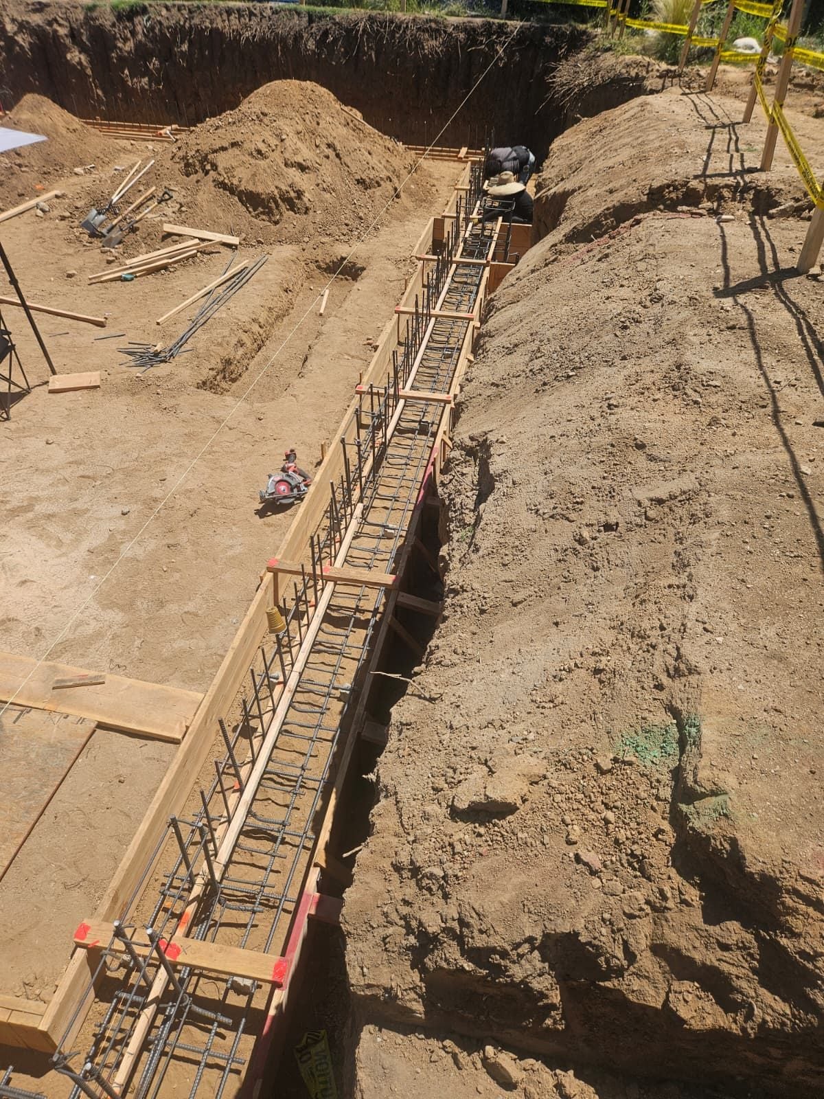 Formed footing run with rebar in place, Mars Civil crew working at the far end